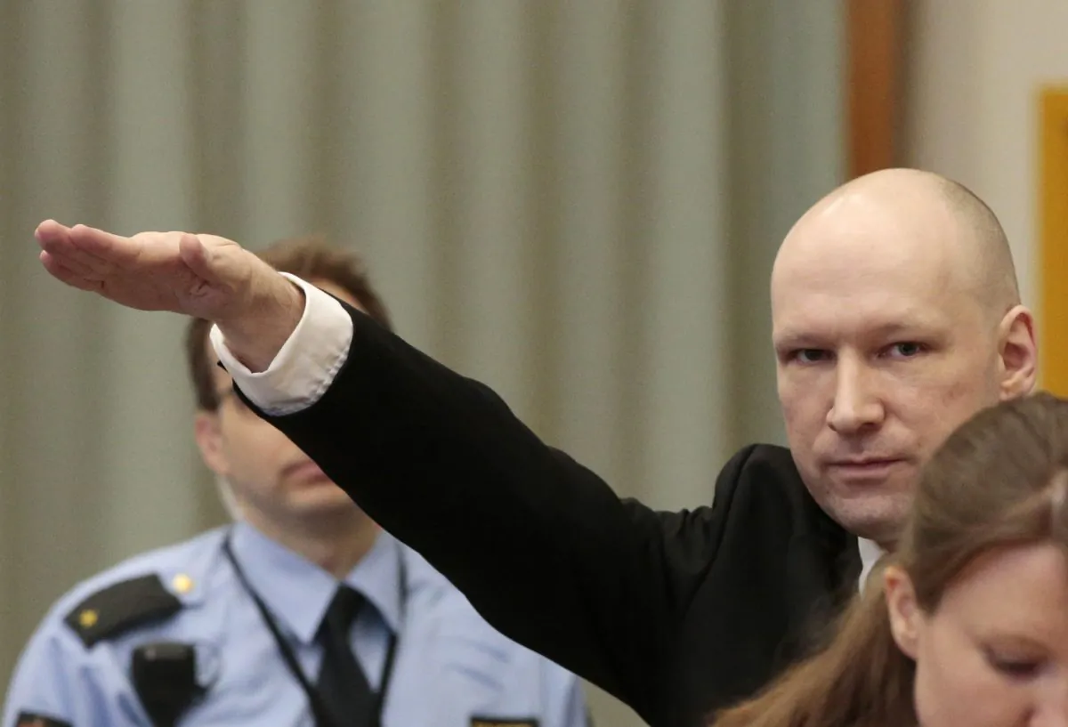Anders Behring Breivik gestures as he enters a courtroom in Skien, Norway, on Tuesday, March 15, 2016. Breivik, the right-wing extremist who killed 77 people in bomb and gun attacks in 2011 arrived in court on Tuesday for his human rights case against the Norwegian government. (Lise Aserud, NTB scanpix via AP) NORWAY OUT