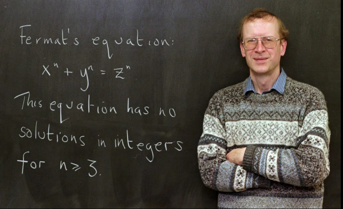 Princeton University mathematics professor Andrew John Wiles poses next to "Fermat's Last Theorem" written on a chalkboard in his Princeton, N.J., office Tuesday, Jan. 6, 1998. Wiles, 44, a native of Cambridge, England, was awarded the $200,000 1998 King Faisal International Prize for solving the 350-year-old mathematical puzzle that scores of mathematicians could not. (AP Photo/Charles Rex Arbogast)