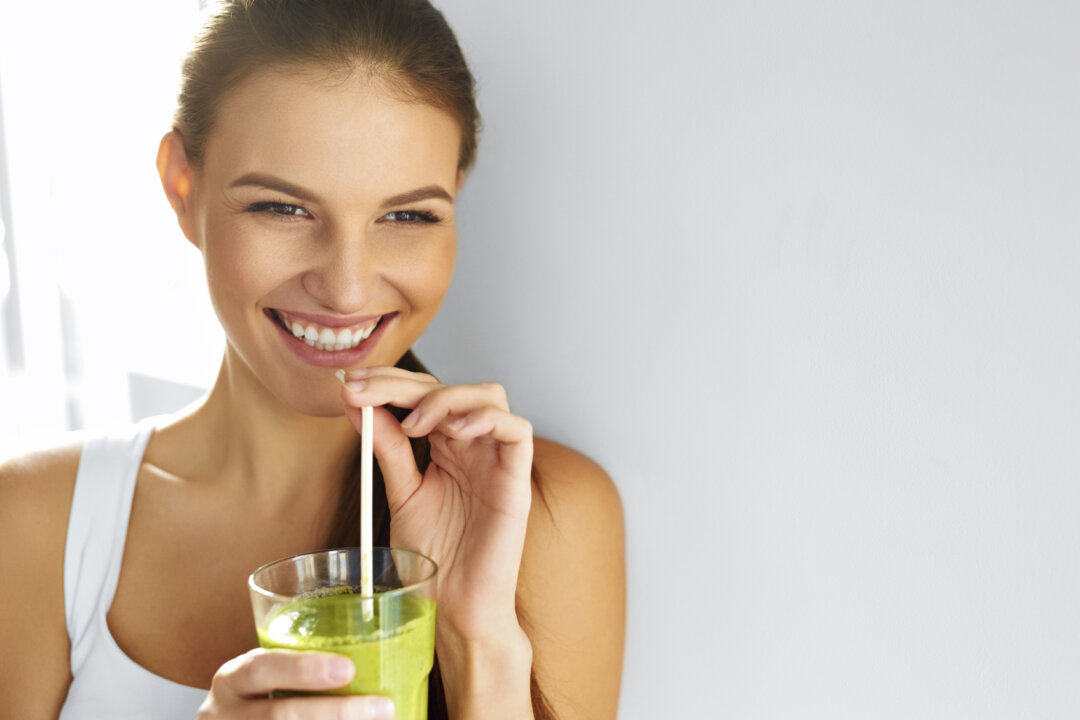 Change your mood by starting your day with a smoothie made from organic coconut water, coconut oil, nut butter, grass-fed collagen, eggs yolks, and frozen berries.(puhhha/iStock)