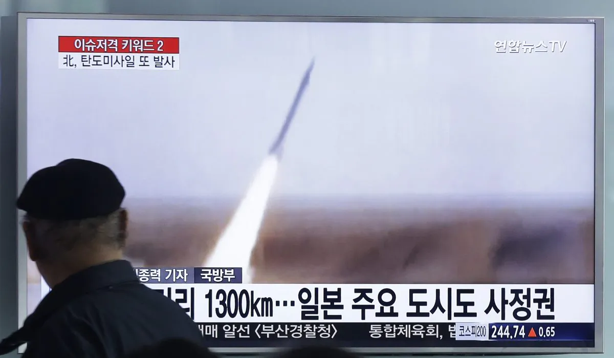 A man watches a TV screen showing a file footage of the missile launch conducted by North Korea, at Seoul Railway Station in Seoul, South Korea, Friday, March 18, 2016. (AP Photo/Ahn Young-joon)
