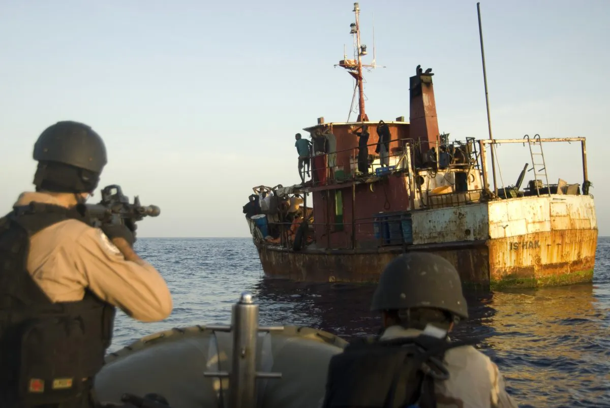 Members of a visit, board, search and seizure (VBSS) team from the guided-missile cruiser USS Gettysburg (CG 64) and U.S. Coast Guard Tactical Law Enforcement Team South Detachment 409 capture suspected pirates after responding to a merchant vessel distress signal while operating in the Combined Maritime Forces (CMF) area of responsibility as part of Combined Task Force (CTF) 151, in the Gulf of Aden, on May 13, 2009. CTF 151 is a multinational task force established to conduct counter-piracy operations under a mission-based mandate throughout the CMF area of responsibility to actively deter, disrupt, and suppress piracy in order to protect global maritime security and secure freedom of navigation for the benefit of all nations. (U.S. Navy/Mass Communication Specialist 1st Class Eric L. Beauregard)