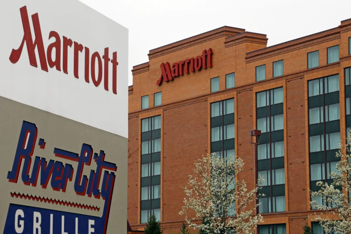 This April, 28, 2014, file photo, shows a Marriott hotel in Cranberry Township, Pa. Marriott wins over Starwood with revised buyout bid to create global hotel giant, announced Monday, March 21, 2016. (AP Photo/Gene J. Puskar, File)