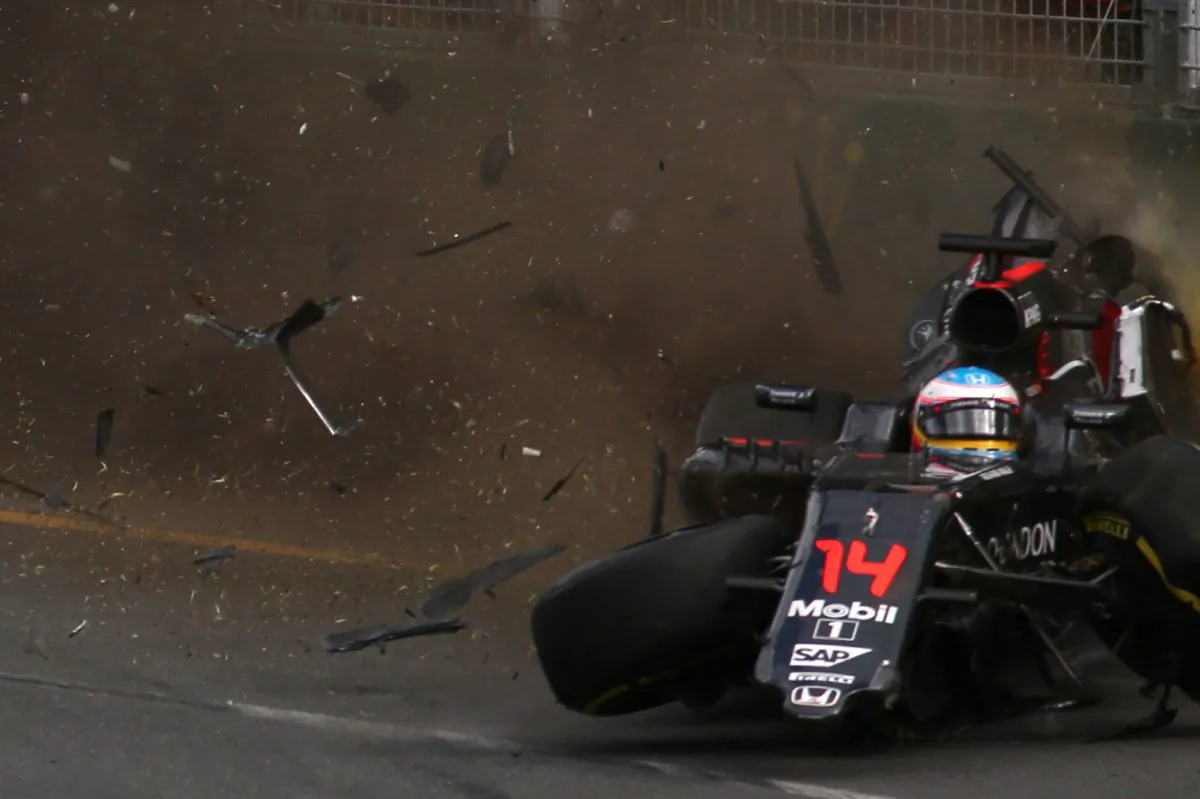 McLaren Honda's Fernando Alonso crashes into the wall after colliding with Haas F1 Team's Esteban Gutierrez during the Formula One Australian Grand Prix in Melbourne. (Max Blyton/AFP/Getty Images)