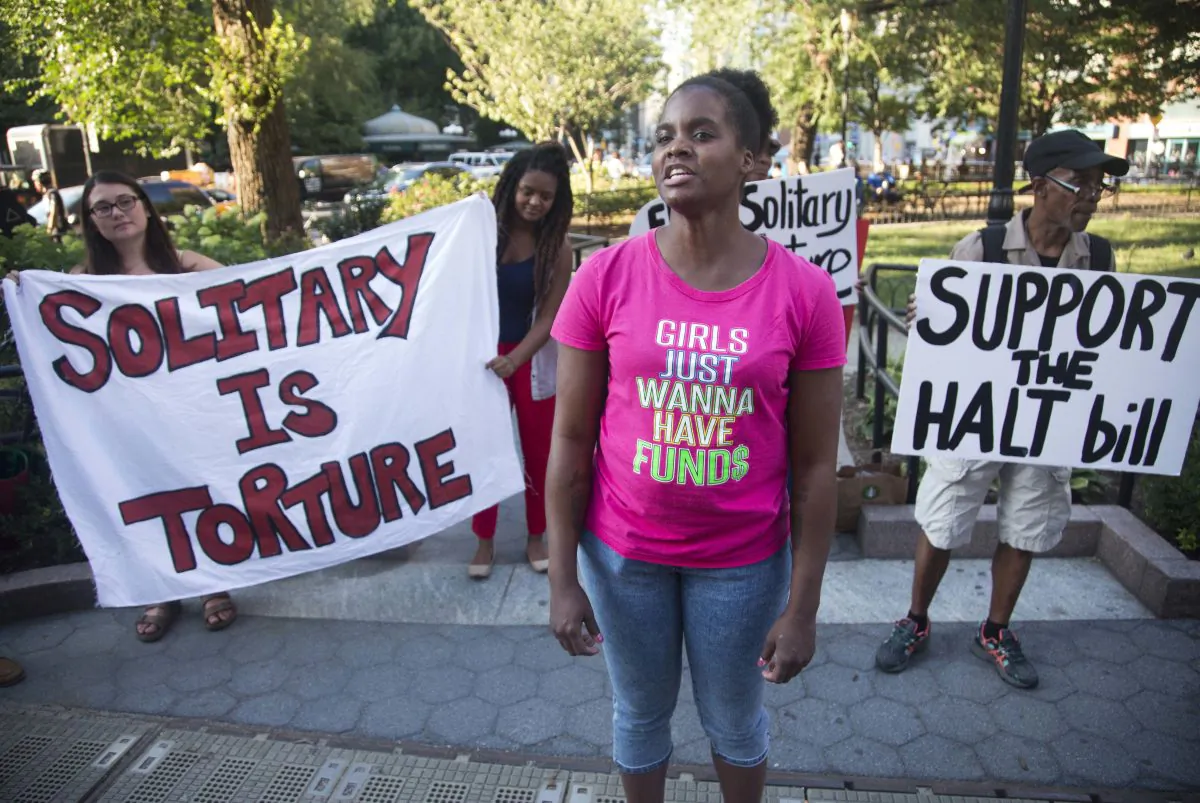 Candie Hailey, center, speaks during a monthly rally calling for the end of solitary confinement in New York, on July 23, 2015. (AP Photo/Bebeto Matthews, File)