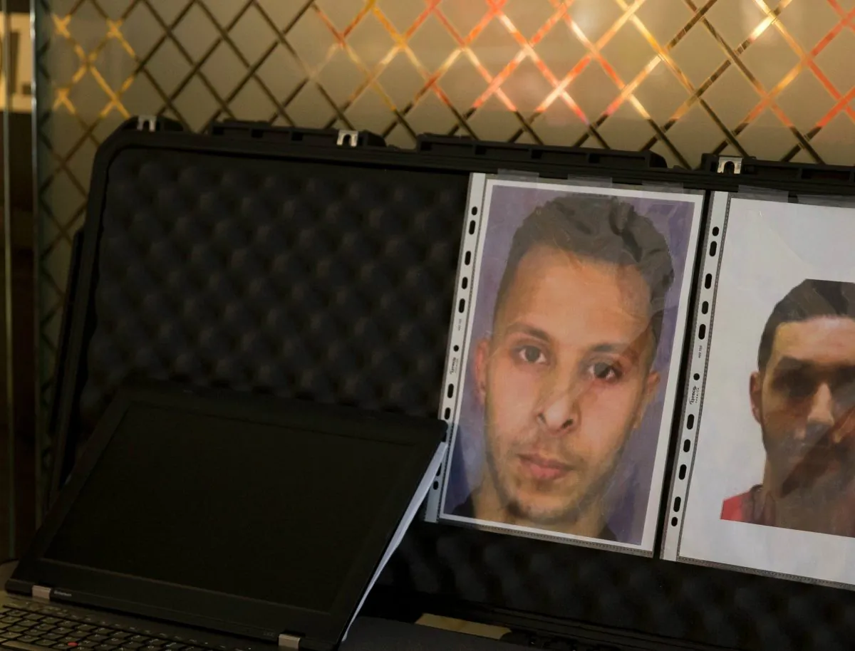 A picture taken on December 3, 2015 at the Roissy-Charles-de-Gaulle airport in Roissy-en-France, outside Paris shows the wanted notice of terrorist Salah Abdeslam (L) and Mohamed Abrini. (Photo Kenzo Tribouillard/AFP/Getty Images)