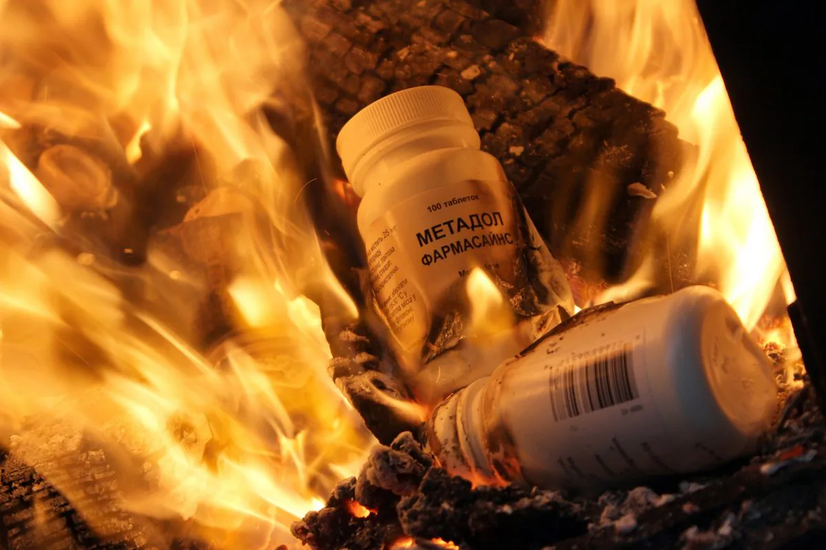 Bottles of synthetic opioid Methadone are burnt during an operation by Russian Federal Drug Control Service officers in Simferopol on Dec. 23, 2014. (Yuri Lashov/AFP/Getty Images)