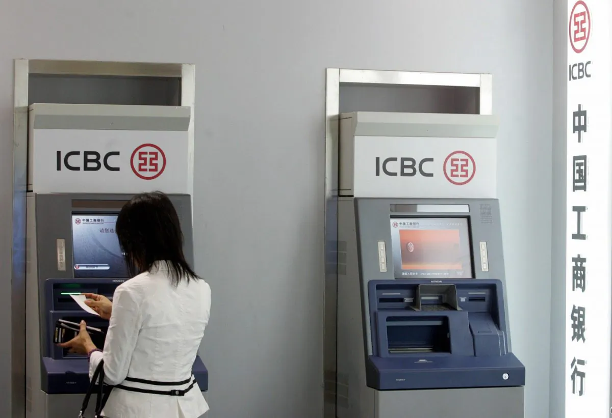 A visitor tries out one of the latest automated-teller machines at banking exhibition in Beijing 13 September 2007. (STR/AFP/Getty Images)