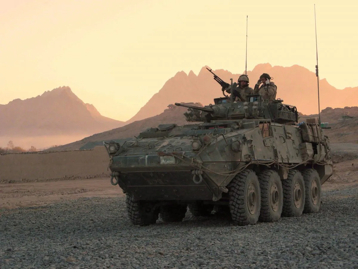 A Canadian light armoured vehicle arrives at a base near Panjwaii, Afghanistan, on Nov.26, 2006. A group of law students and their professor are seeking to block Ottawa’s controversial decision to allow the sale of light armoured vehicles to Saudi Arabia. (The Canadian Press/Bill Graveland)