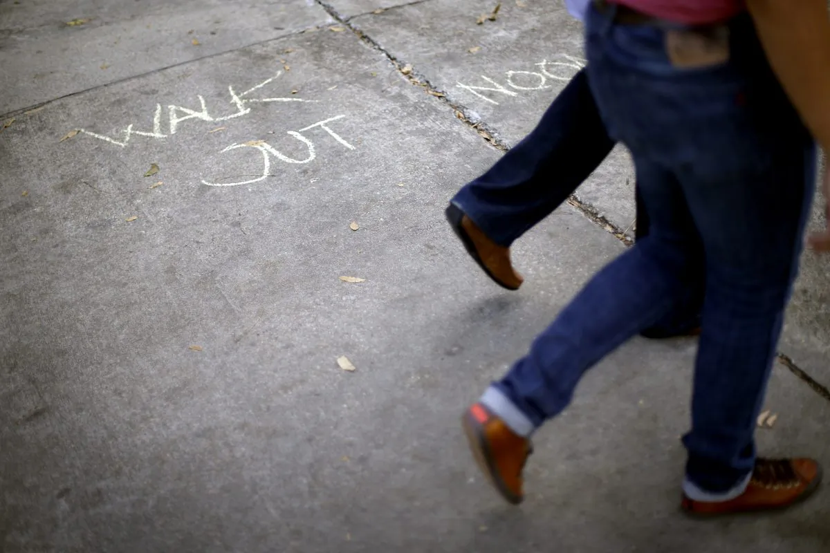 A chalk message outside the administrative offices at Emory University, Tuesday, Dec. 4, 2012. (AP Photo/David Goldman)
