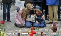 Brussels Mourns, Belgium on Alert as Police Hunt Suspect