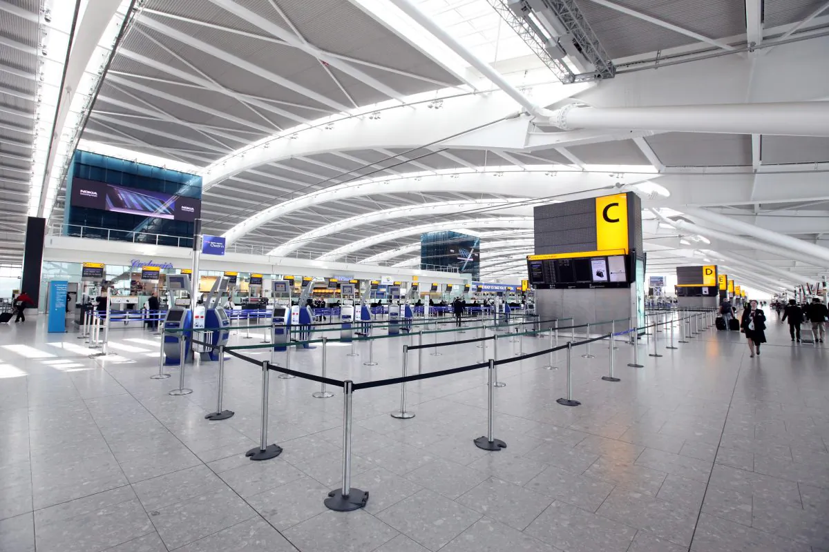 British Airways check-in desks stand empty in the departures hall of Heathrow Airport's Terminal 5 building in London, England, on April 20, 2010. (Oli Scarff/Getty Images)