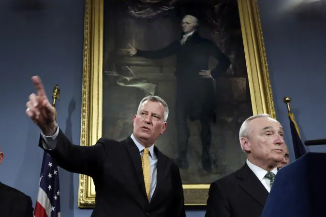 New York Mayor Bill deBlasio, left, and New York City Police Commissioner William Bratton address a news conference in New York's City Hall, Tuesday, Jan. 12, 2016. (Richard Drew/AP)