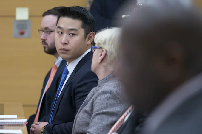 Police officer Peter Liang, second from left, sits with his legal team while waiting for charges to be read back to the jury in his trial on charges in the shooting death of Akai Gurley, Thursday, Feb. 11, 2016 at Brooklyn Supreme court in New York in New York. (Mary Altaffer/AP)