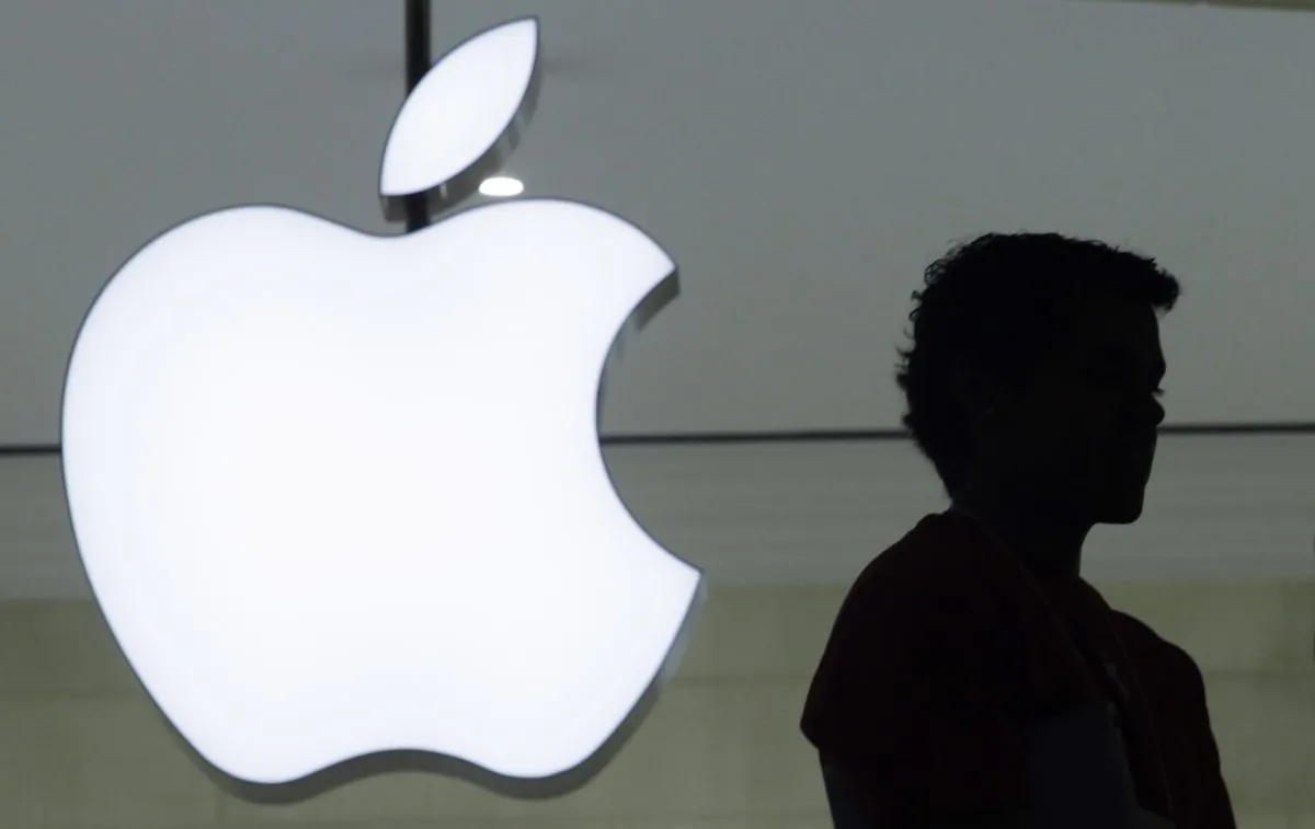 Dec. 7, 2011, file photo, a person stands near the Apple logo at the company's store in Grand Central Terminal, in New York. (AP Photo/Mark Lennihan, File)