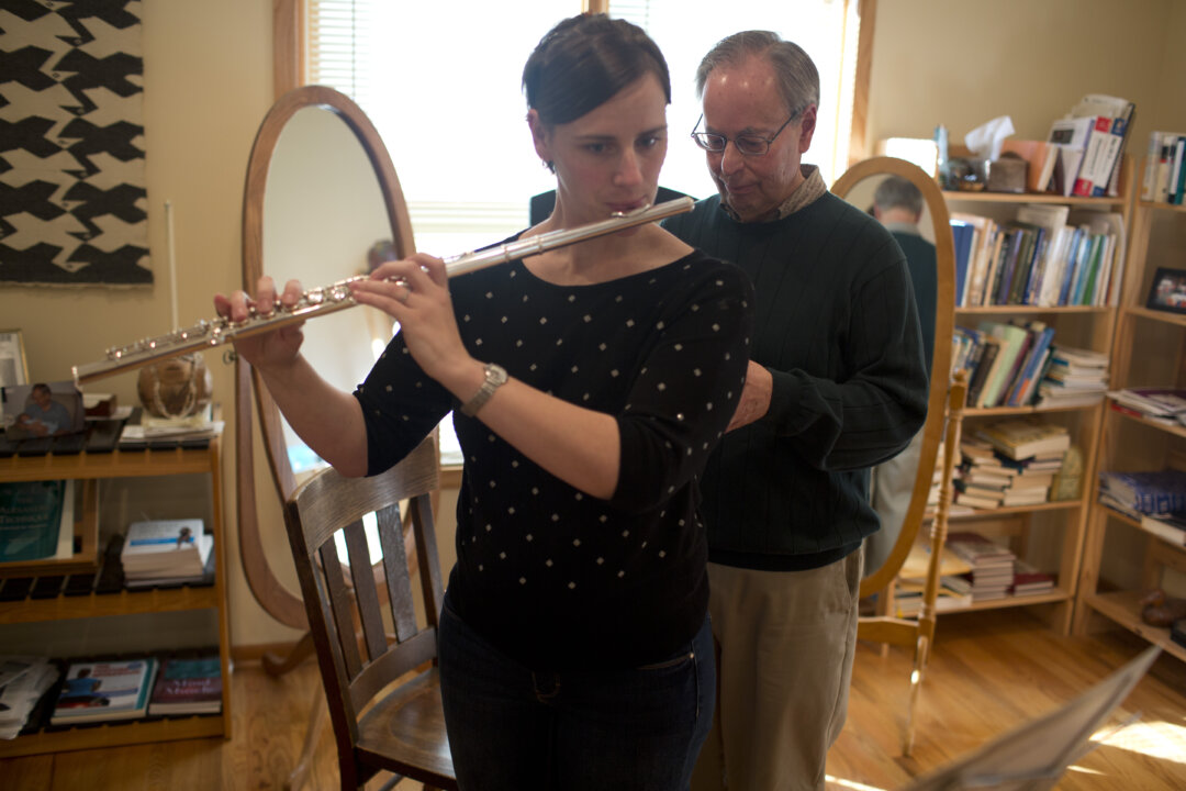 Robert Rickover uses the Alexander Technique to help a flute player.
(Courtesy of Robert Rickover)