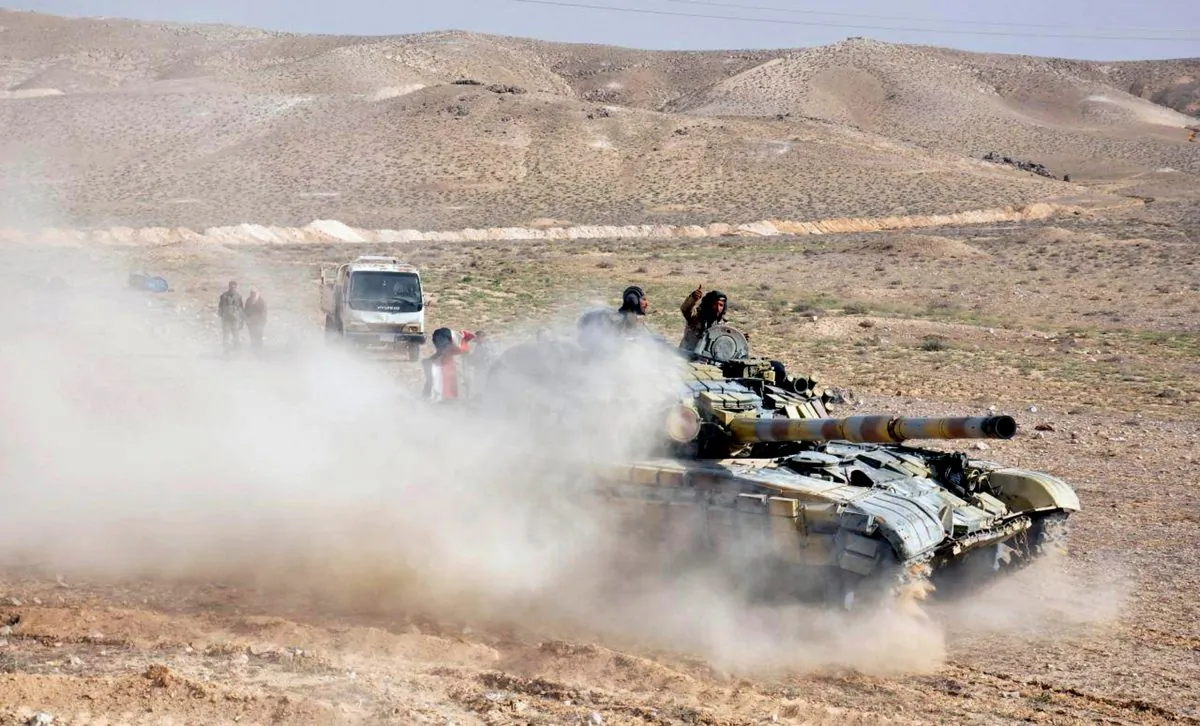 In this photo released on March 24, 2016, by the Syrian official news agency SANA, Syrian government soldiers take position near the entrance of Palmyra town, central Syria. Syrian government forces recaptured a Mamluk-era citadel in Palmyra from the extremist Islamic State group on Friday, Syrian state media and monitoring groups said, as the fierce battle for control of the historic town entered its third day. (SANA via AP)