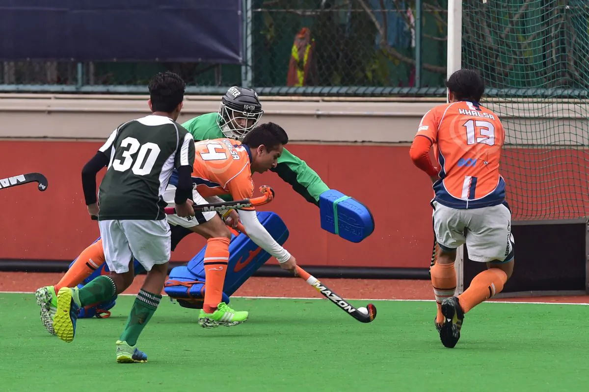 Inderpal Singh scores the first of his three goals in Khalsa’s 9-0 victory over Pak-A in the HKHA premier league at HKFC on Sunday March 20. (Bill Cox/Epoch Times)