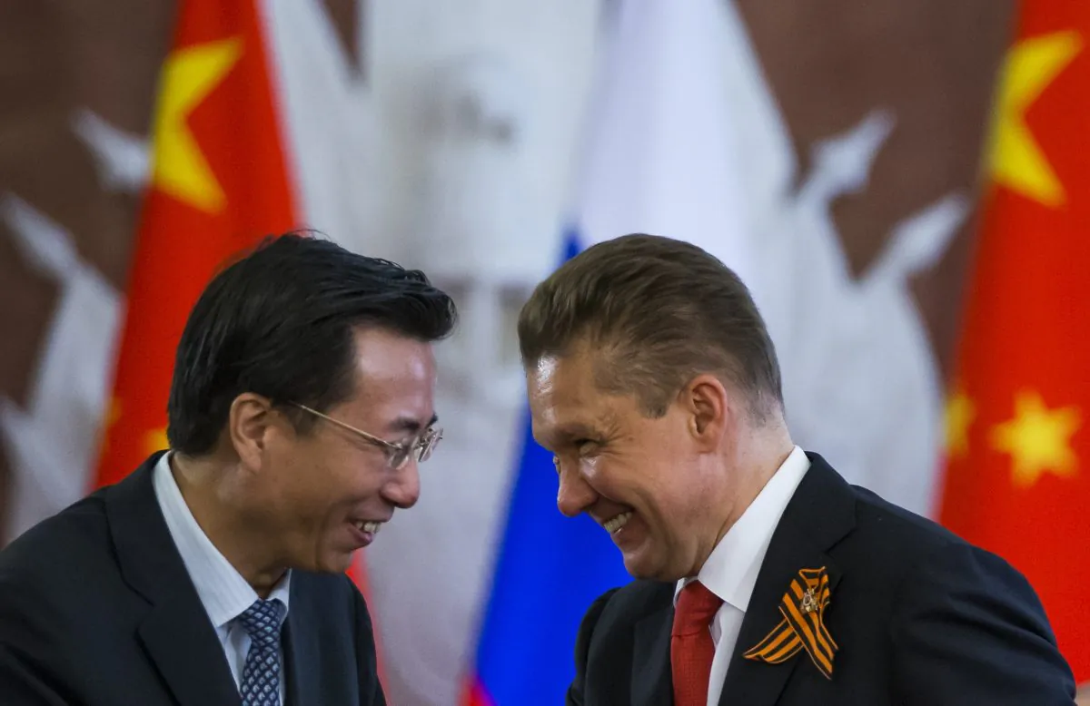 Wang Dongjin (L), vice president of China National Petroleum Corporation (CNPC), and Alexei Miller, CEO of Russian natural gas giant Gazprom at a bilateral ceremony in Moscow on May 8, 2015. (AP Photo/Alexander Zemlianichenko)