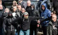 Riot at Brussels Attacks Shrine; 13 Anti-Terror Raids Made