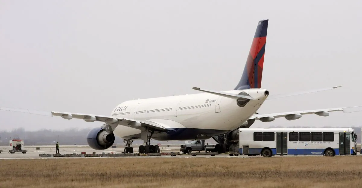 A Delta Airlines jet sits at a remote part of the Detroit Metropolitan Airport on December 27, 2009 (Bill Pugliano/Getty Images)