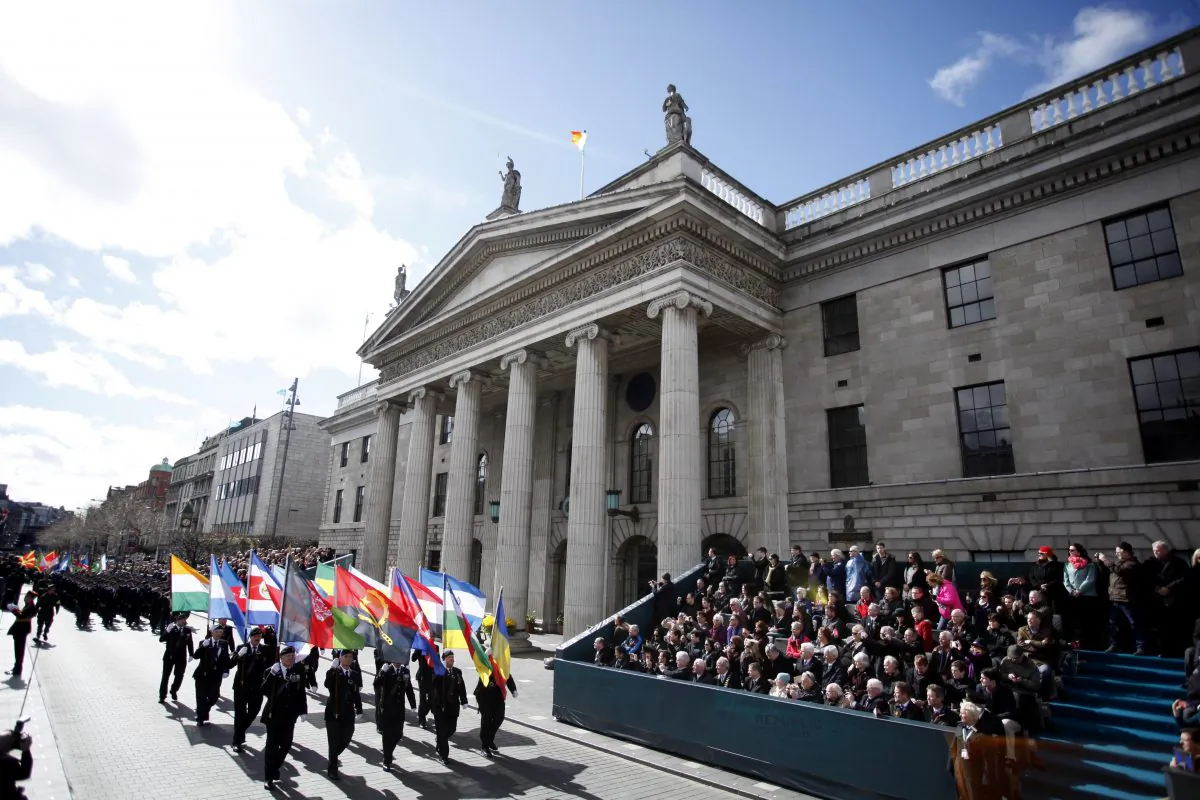 Thousands of soldiers marched solemnly Sunday, March 27, 2016 through the crowded streets of Dublin to commemorate the 100th anniversary of Ireland's Easter Rising against Britain, a fateful rebellion that reduced parts of the capital to ruins and inspired the country's eventual independence. (AP Photo/Peter Morrison)