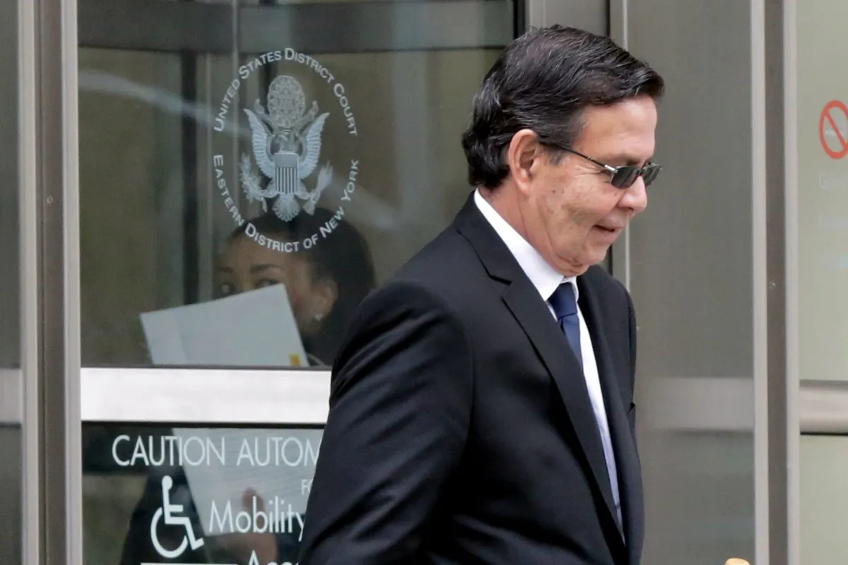 Former Honduran President Rafael Callejas leaves federal court in New York, Monday, March 28, 2016. Callejas has pleaded guilty to conspiracy charges in a wide-ranging FIFA soccer scandal. (AP Photo/Richard Drew)