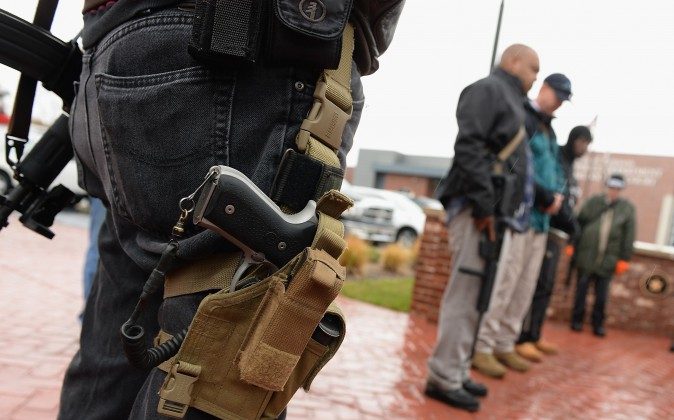 Open carry gun activists participate in a march in Ferguson, Mo., on Nov. 16, 2015. (Michael B. Thomas/AFP/Getty Images)