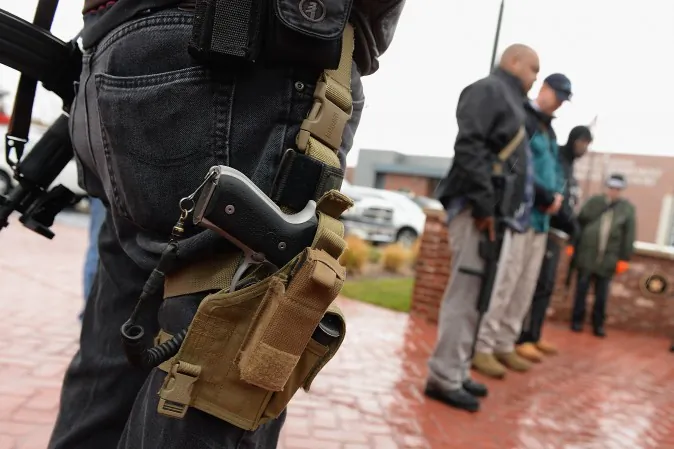 Open carry gun activists participate in a march in Ferguson, Mo., on Nov. 16, 2015. (Michael B. Thomas/AFP/Getty Images)