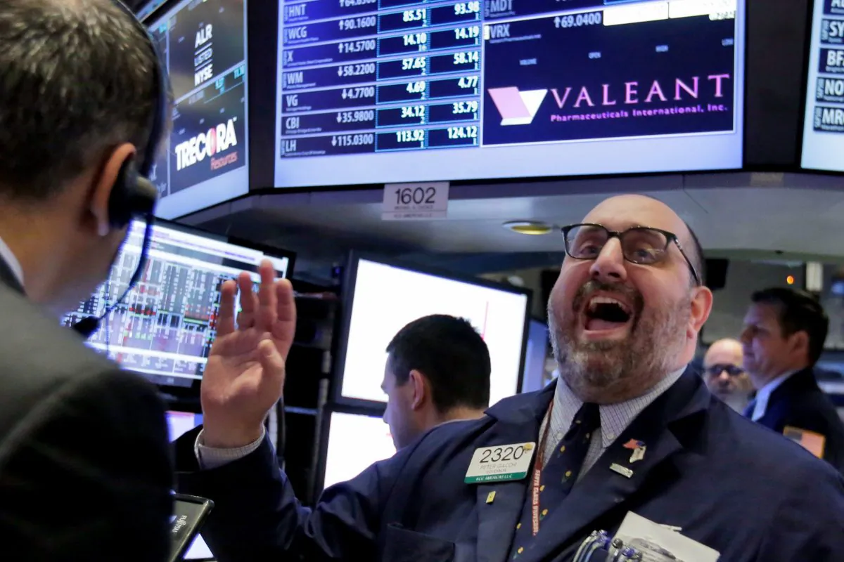Specialist Peter Giacchi calls out prices at the post that handles Valeant Pharmaceuticals on the floor of the New York Stock Exchange, Tuesday, March 15, 2016. (AP Photo/Richard Drew)