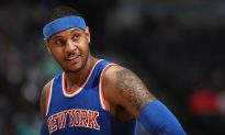 Kid Rushes Onto Court to Hug Carmelo Anthony