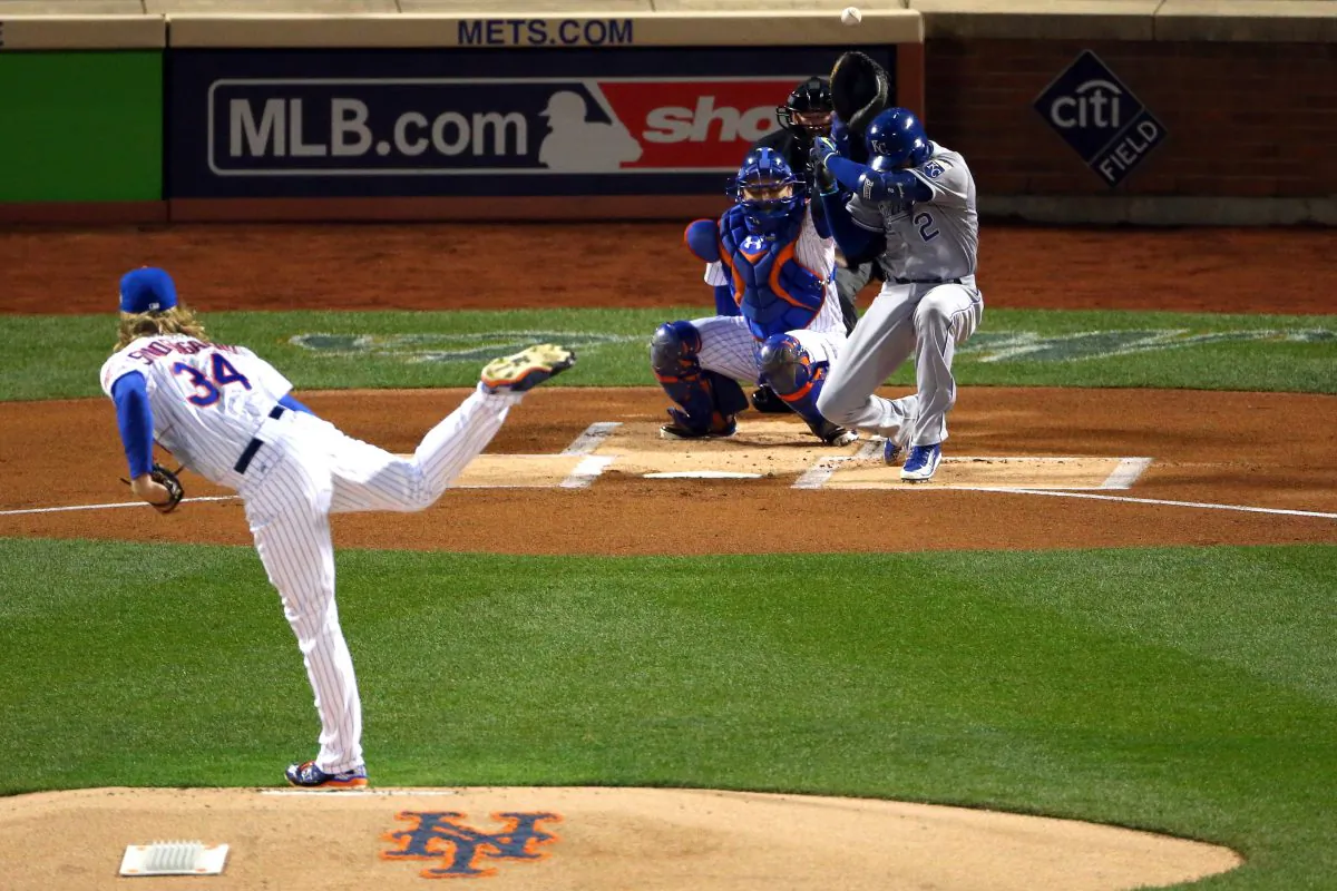 Alcides Escobar (R) of the Kansas City Royals is brushed back by a pitch from Noah Syndergaard  of the New York Mets in the first inning of Game 3 of the 2015 World Series. (Elsa/Getty Images)