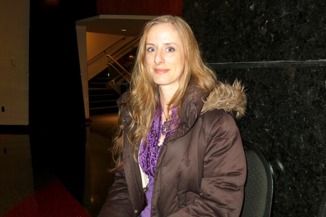Rachel Davis enjoys Shen Yun Performing Arts on  Tuesday night at the Clay Center for the Arts & Sciences of West Virginia. (Sally Sun/Epoch Times)