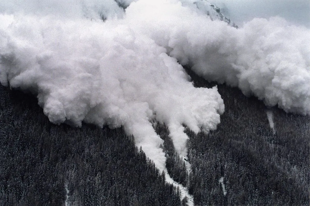 An aerial view of one of two avalanches making its way through the landscape as it hits into the Swiss ski resort of Evolene, Swiss Alps, on Feb. 22, 1999. (Fabrice Coffrini/AFP/Getty Images)