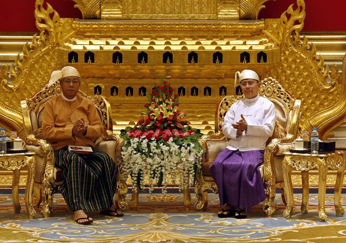 Burma's new president, academic, and long-time NLD stalwart Htin Kyaw (L) and outgoing President Thein Sein (R) during the handover ceremony at the president's house in Naypyidaw on March 30, 2016. A close aide to Aung San Suu Kyi was sworn in as Burma's president on March 30, a role that will see him act as a proxy for the pro-democracy figurehead and carry the hopes of a nation emerging from military rule. (Nyein Chan Naing/AFP/Getty Images)
