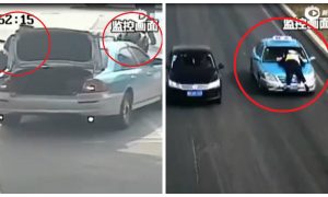 A Taxi Driver in China Speeds Away With a Police Officer on Hood
