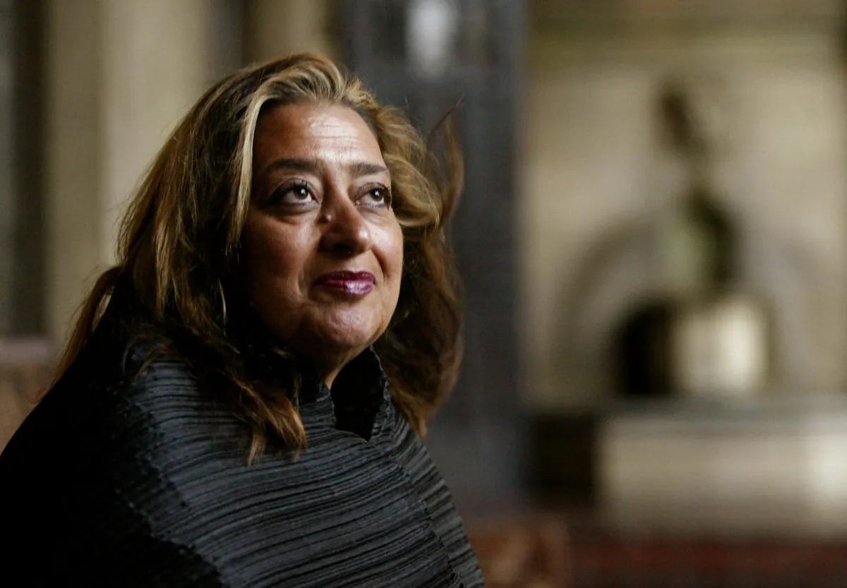 In this March 21, 2004 file picture, Iraqi-British architect Zaha Hadid poses in West Hollywood, Calif. Hadid, whose modernist, futuristic designs included the swooping aquatic center for the 2012 London Olympics, has died aged 65, Thursday, March 31, 2016. (AP Photo/Kevork Djansezian, File)