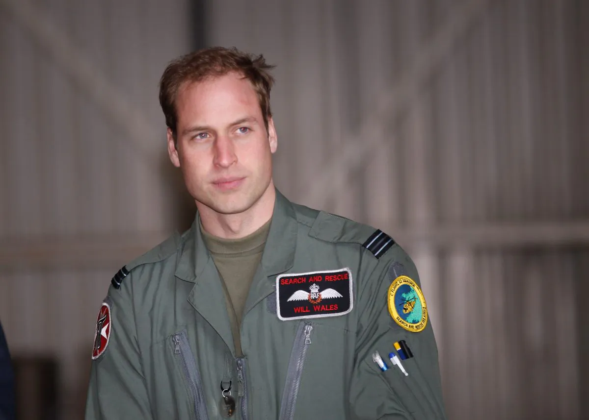 Prince William waits for his grandmother Queen Elizabeth II to arrive for an offical visit to RAF Valley where Prince William is stationed as a search and rescue helicopter pilot on April 1, 2011 in Holyhead, United Kingdom. (Christopher Furlong - WPA Pool/Getty Images)