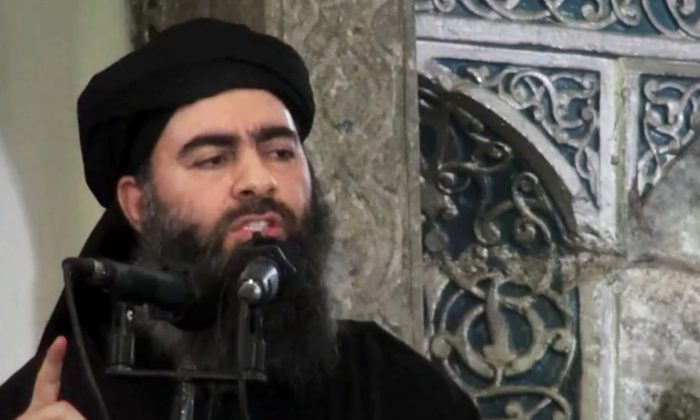 The leader of the ISIS terrorist group Abu Bakr al-Baghdadi at a mosque in Iraq on July 5, 2014. (AP Photo/extremist video)