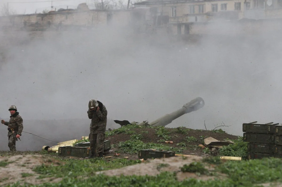 Armenian servicemen of the self-defense army of Nagorno-Karabakh fire an artillery shell towards Azeri forces from their positions in the town of Martakert in Armenian-seized Azerbaijani region of Nagorny-Karabakh on April 3, 2016. Clashes between Azerbaijani and Armenian forces rumbled on April 3, despite Baku announcing a cease-fire after the worst outbreak of violence in decades over the disputed Nagorny-Karabakh region sparked international pressure to stop fighting. (Vahram Baghdasaryan/AFP/Getty Images)