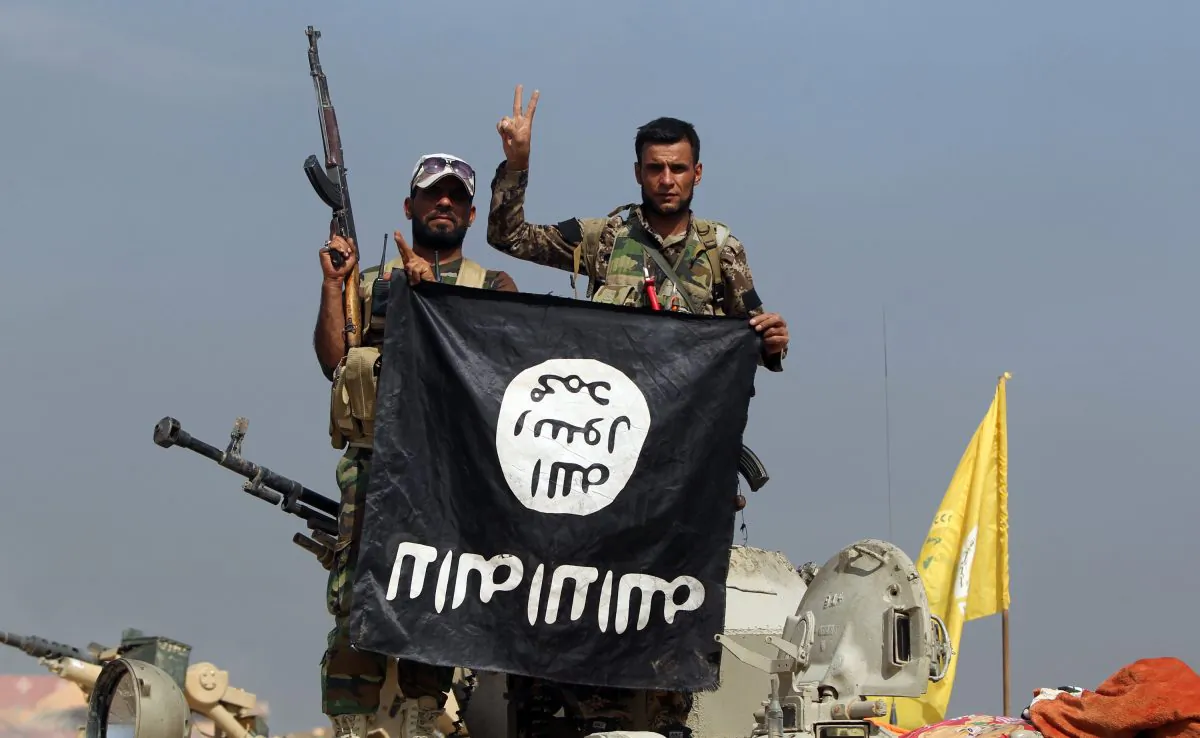 The flag of the Islamic State (ISIS) during a military operation aimed at the center of Baiji, some 200 kilometers north of Baghdad, on Oct. 19, 2015. (Ahmad al-Rubaye/AFP/File Photo via Getty Images)