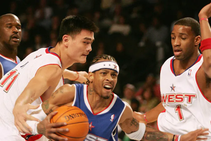 China's Yao Ming (L) of the Western Conference team defends against Allen Iverson (C) of the Eastern Conference as the West's Tracy McGrady (R) and the East's Shaquille O'Neal (far L) look on during the NBA All-Star game 20 February 2005 in Denver. Iverson was named Most Valuable Player (MVP) of the game as the East won 125-115. (DON EMMERT/AFP/Getty Images)