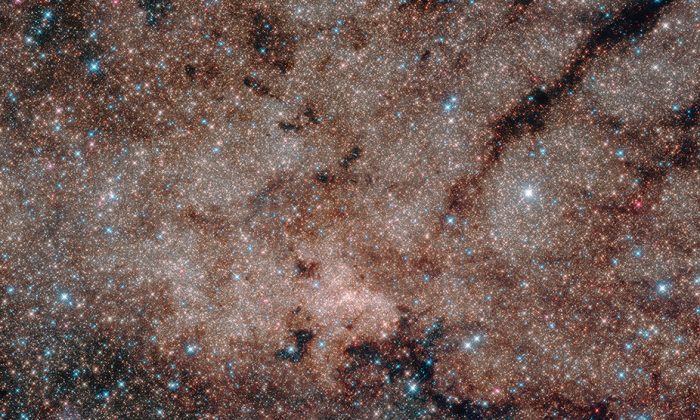 Except for a few blue foreground stars, the stars are part of the Milky Way’s nuclear star cluster, the most massive and densest star cluster in our galaxy. (NASA, ESA, and Hubble Heritage Team) (STScI/AURA, Acknowledgment: T. Do, A.Ghez (UCLA), V. Bajaj (STScI)