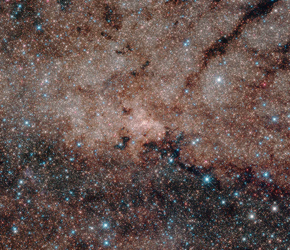 Except for a few blue foreground stars, the stars are part of the Milky Way’s nuclear star cluster, the most massive and densest star cluster in our galaxy. (NASA, ESA, and Hubble Heritage Team) (STScI/AURA, Acknowledgment: T. Do, A.Ghez (UCLA), V. Bajaj (STScI)