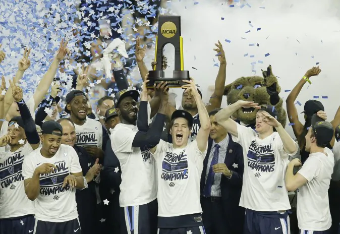 Villanova players celebrate after the NCAA Final Four tournament college basketball championship game against North Carolina, Monday, April 4, 2016, in Houston. Villanova won 77-74. (AP Photo/Charlie Neibergall)