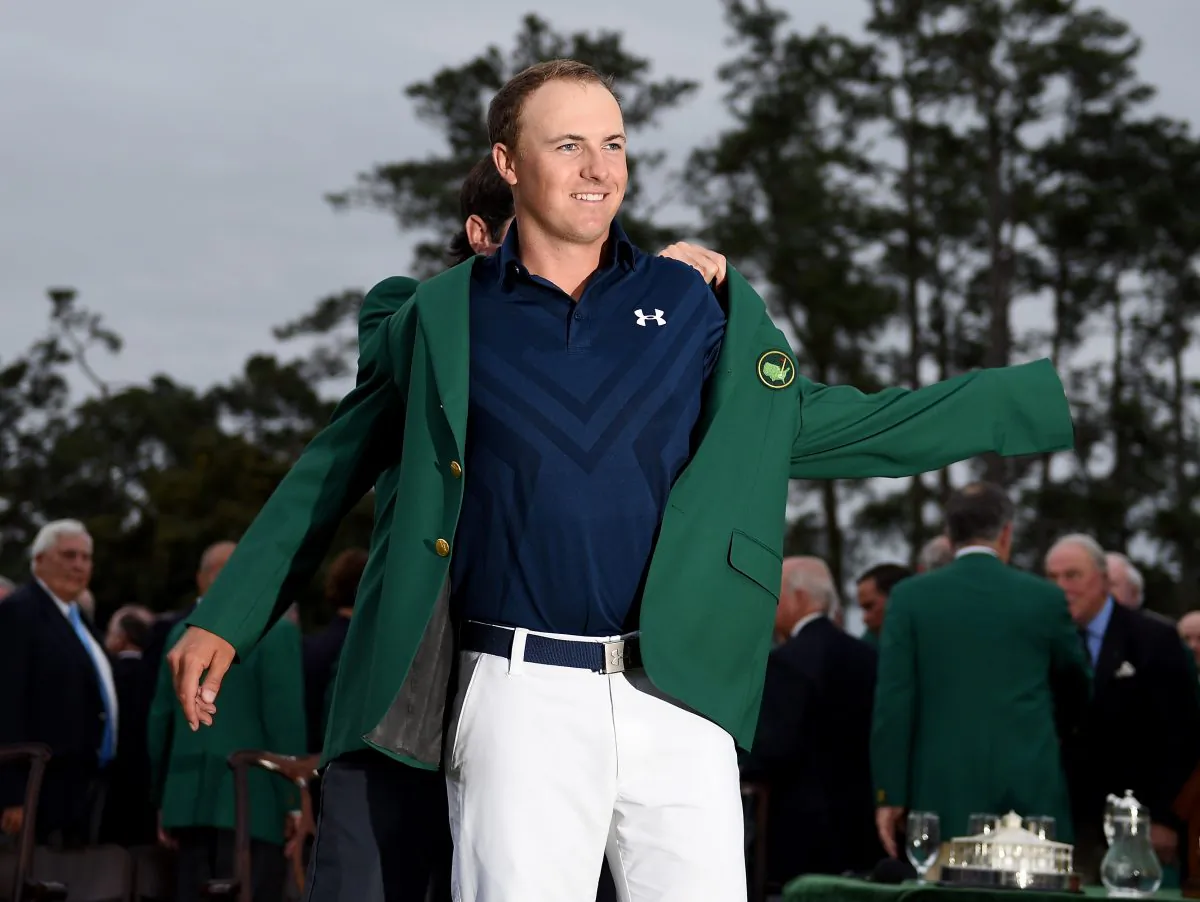 Jordan Spieth is presented with his Green Jacket after the final round of the 2015 Masters at Augusta National Golf Club. (Ross Kinnaird/Getty Images)