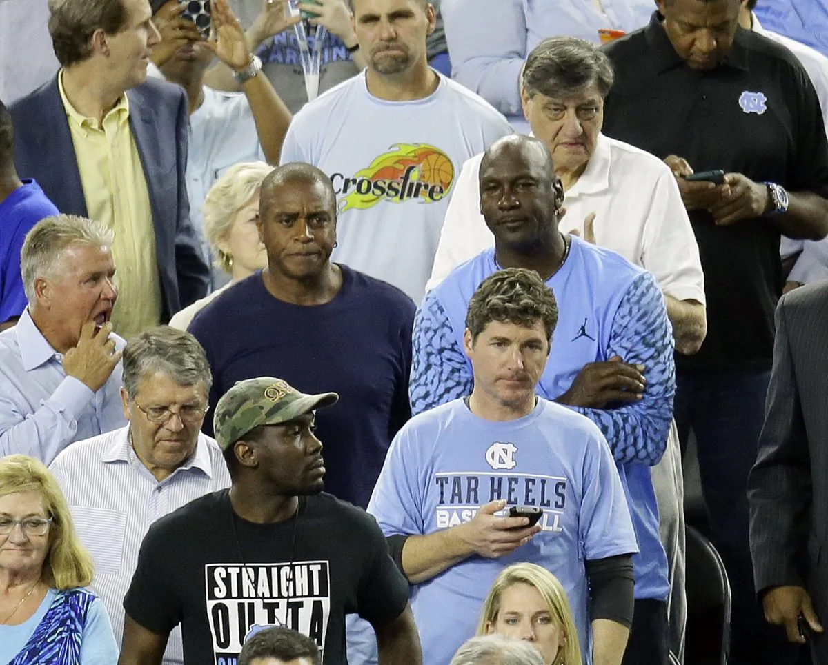 Former North Carolina and NBA star Michael Jordan watches the championship game between Villanova and North Carolina. (AP Photo/Charlie Neibergall) 