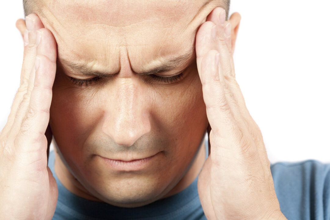 A stock photo of a migraine sufferer (Catalin Petolea/iStock)
