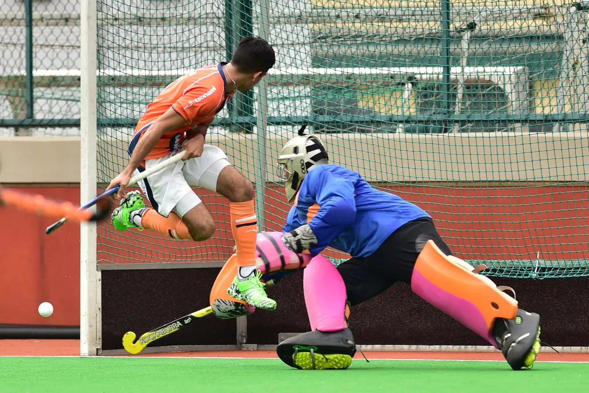 Khalsa captain Dev Dillon narrowly misses deflecting this ball towards the gaol. But SSSC keeper is well in position to defend in their final Premier division match of the 2015-16 season at HKFC on Sunday April 3. (Bill Cox/Epoch Times)