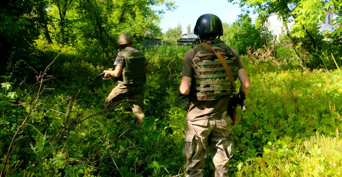 Ukrainian soldiers on patrol in Pisky. (Nolan Peterson/The Daily Signal)