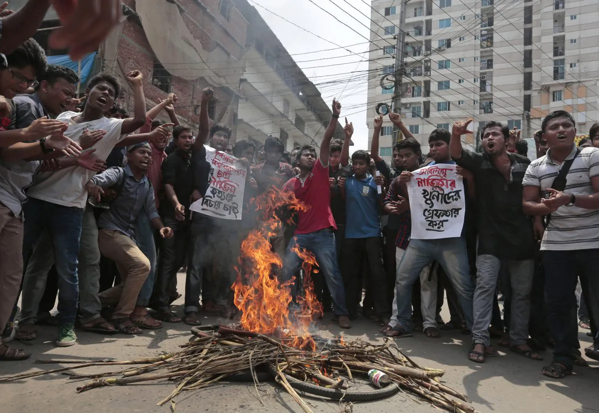 Bangladeshi students protest seeking arrest of three motorcycle-riding assailants who hacked student activist Nazimuddin Samad to death as he walked with a friend, in Dhaka, Bangladesh, Thursday, April 7, 2016. ( AP Photo)